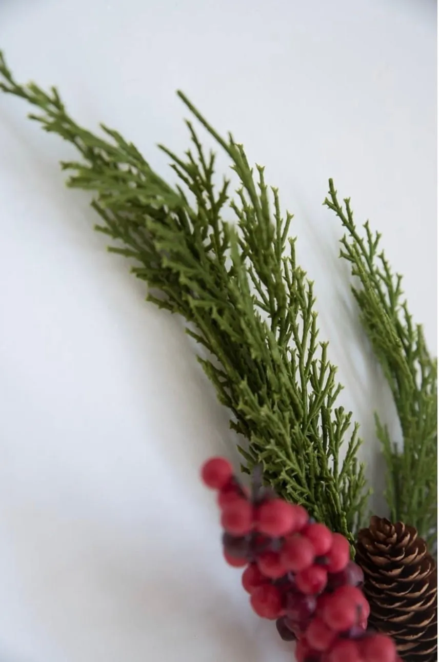 Artificial cedar and red berries branch